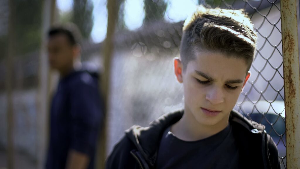 upset teen in a detention center
